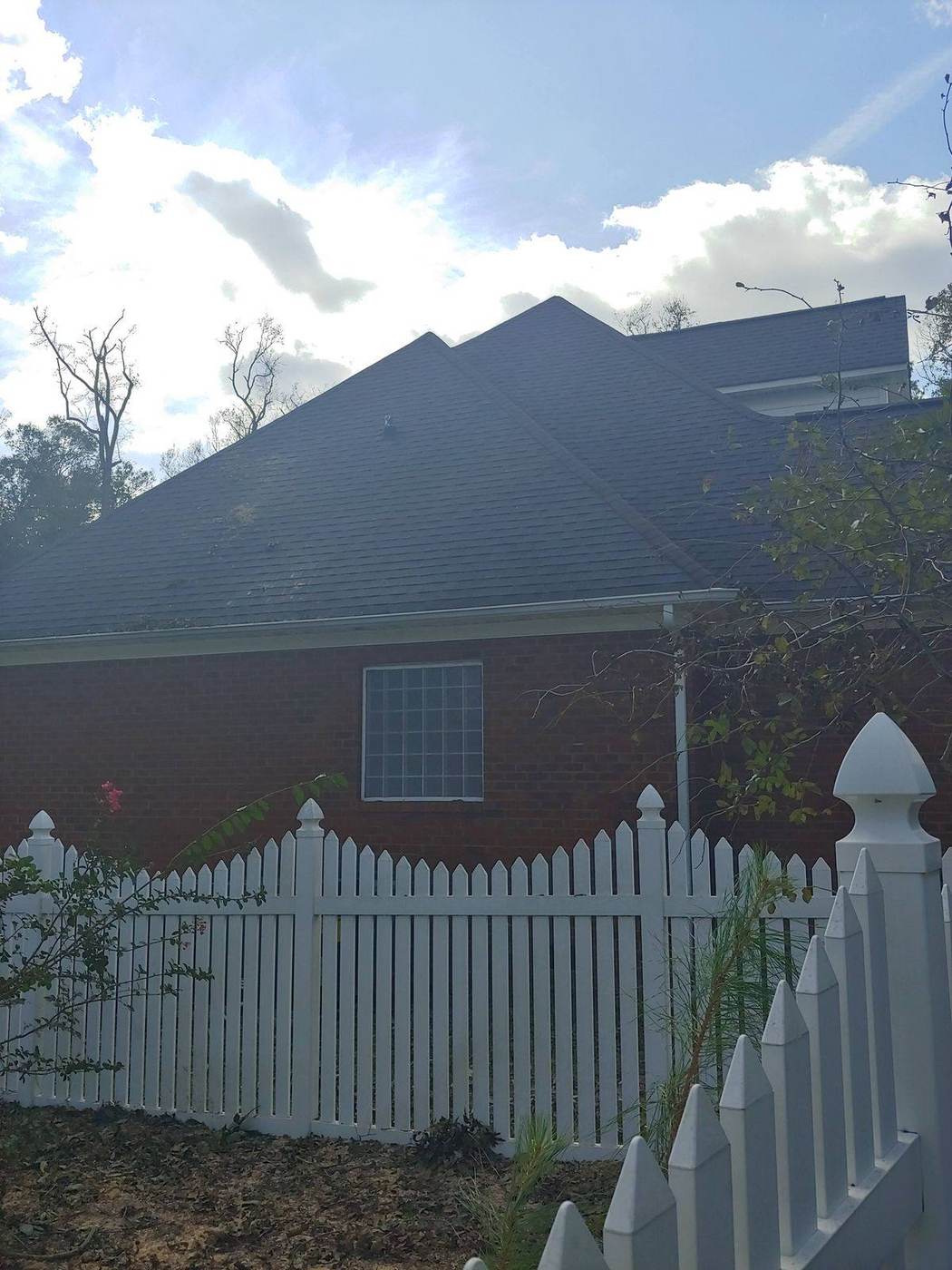 Same home with the tree removed and roof clear